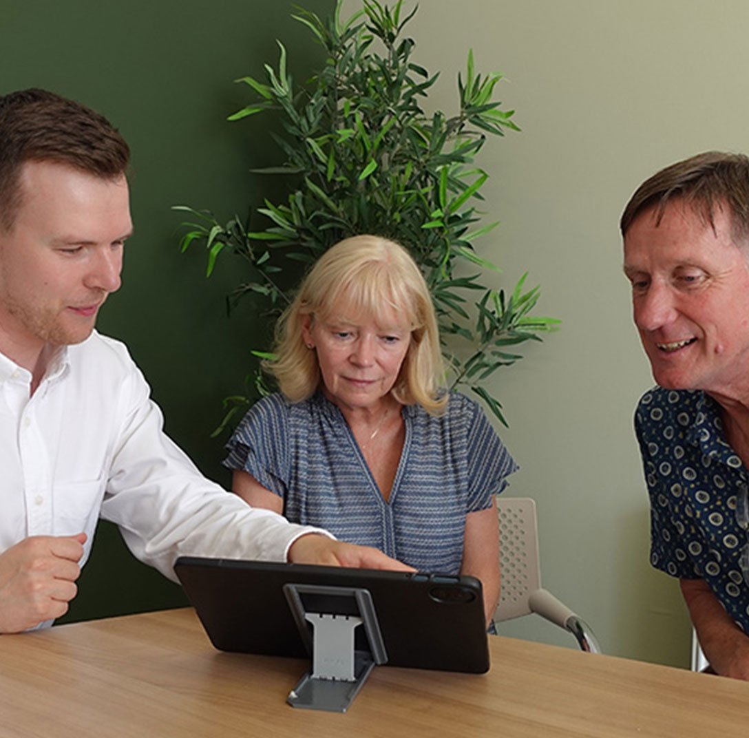 Financial adviser building a cashflow model and retirement forecast for a client in Manchester